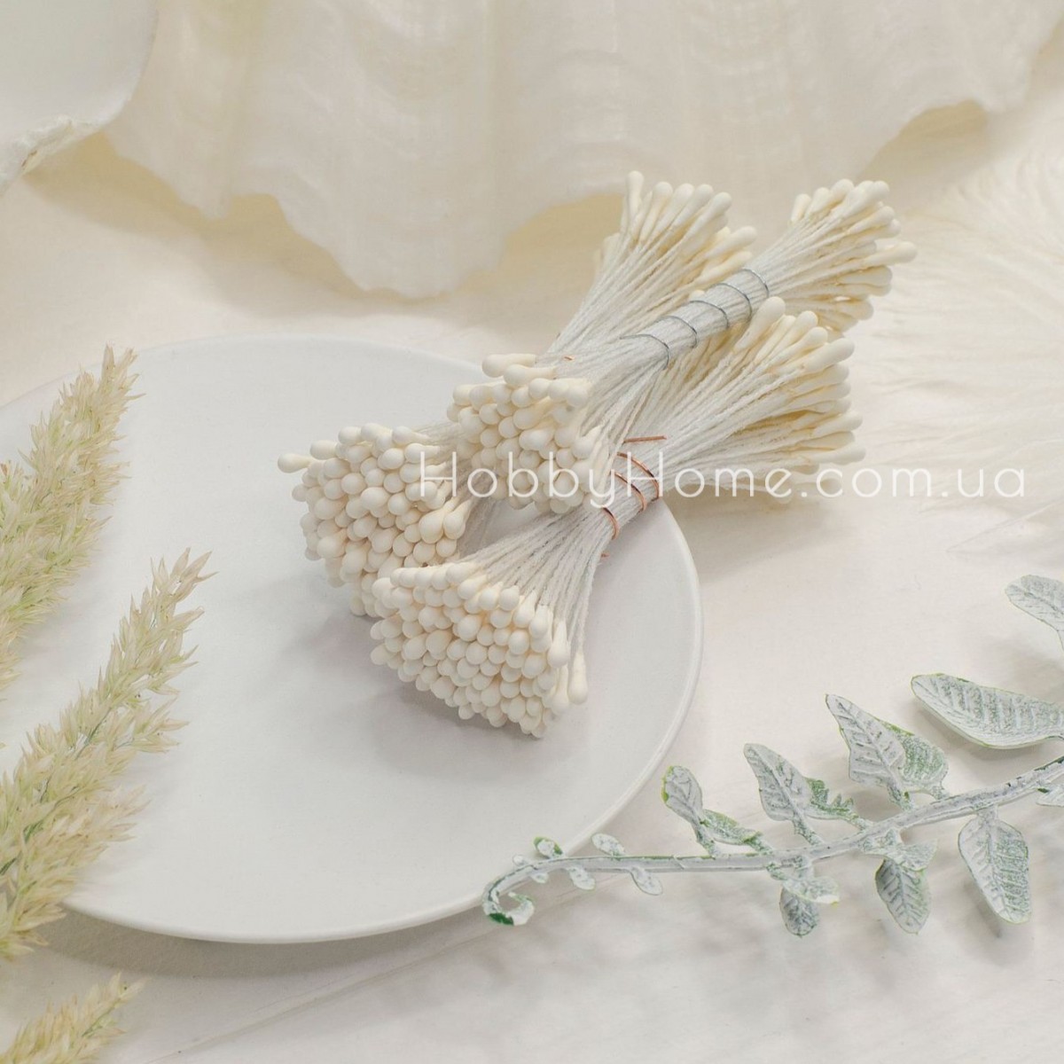 Матові тичинки кольору айворі 2 мм, двосторонні на нитці Матові тичинки кольору айворі 2 мм, двосторонні на нитці